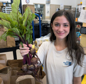 Open Table volunteer with beets