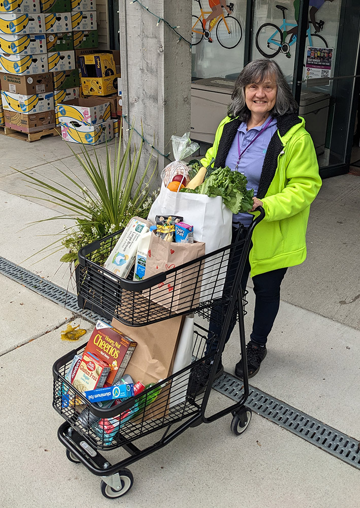 Volunteer with grocery cart